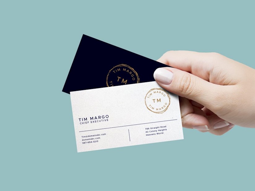 female hand holding business cards mockup