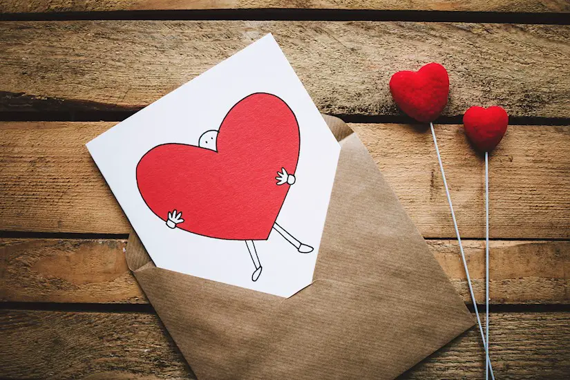 white black and red person carrying heart illustration in valentine image