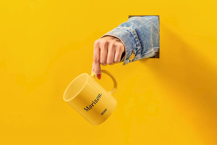 free cup with hand mockup psd