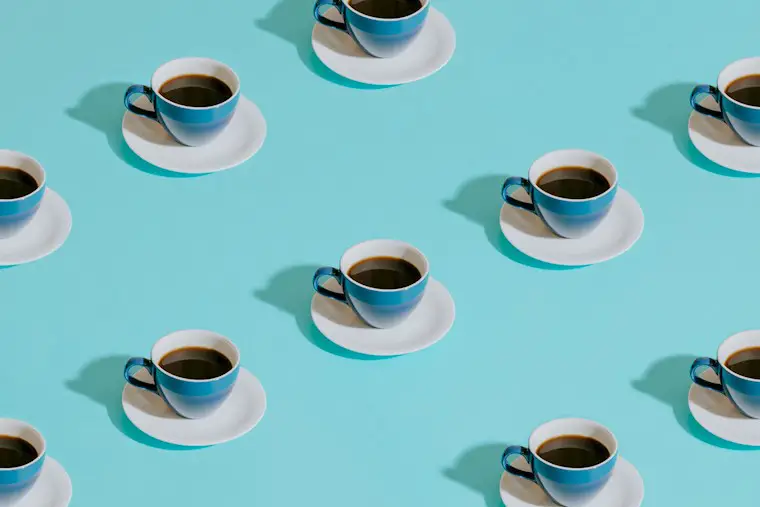 blue cups on a blue table wallpaper