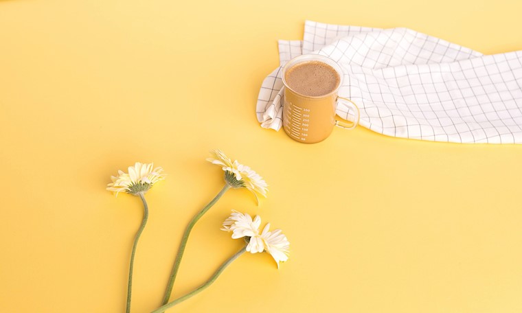coffee cup on the yellow table wallpaper