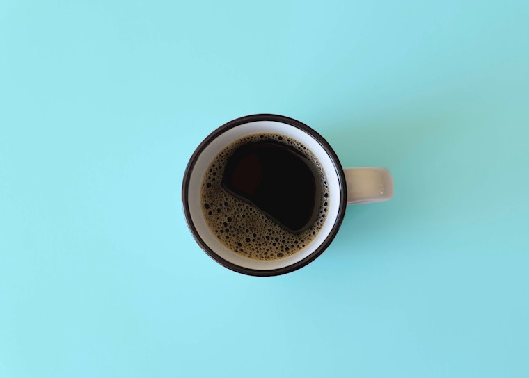 cup of coffee on a blue table wallpaper