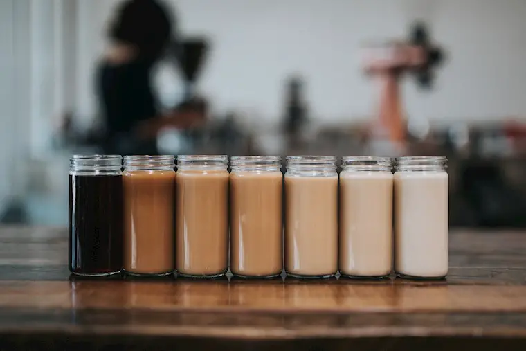 seven jars of coffee on the table wallpaper