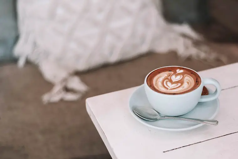 white ceramic cup of coffe background